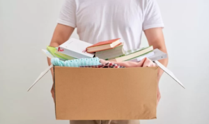 Man throwing things away in box, Decluttering, Cleaning Motivation, New year, Spring cleaning for new year, Style Degree, Singapore, SG, StyleMag